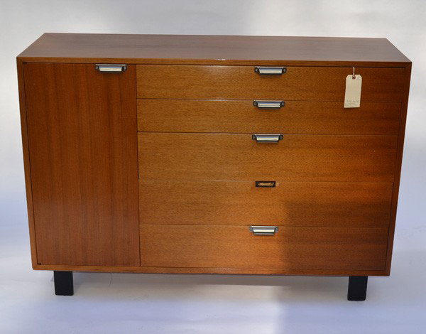 George Nelson Modern Credenza: George Nelson walnut and oak credenza for Herman Miller. Bears five drawers and one door at left concealing three shelves on straight ebonized feet. Brushed nickel pulls are later replacements, otherw
