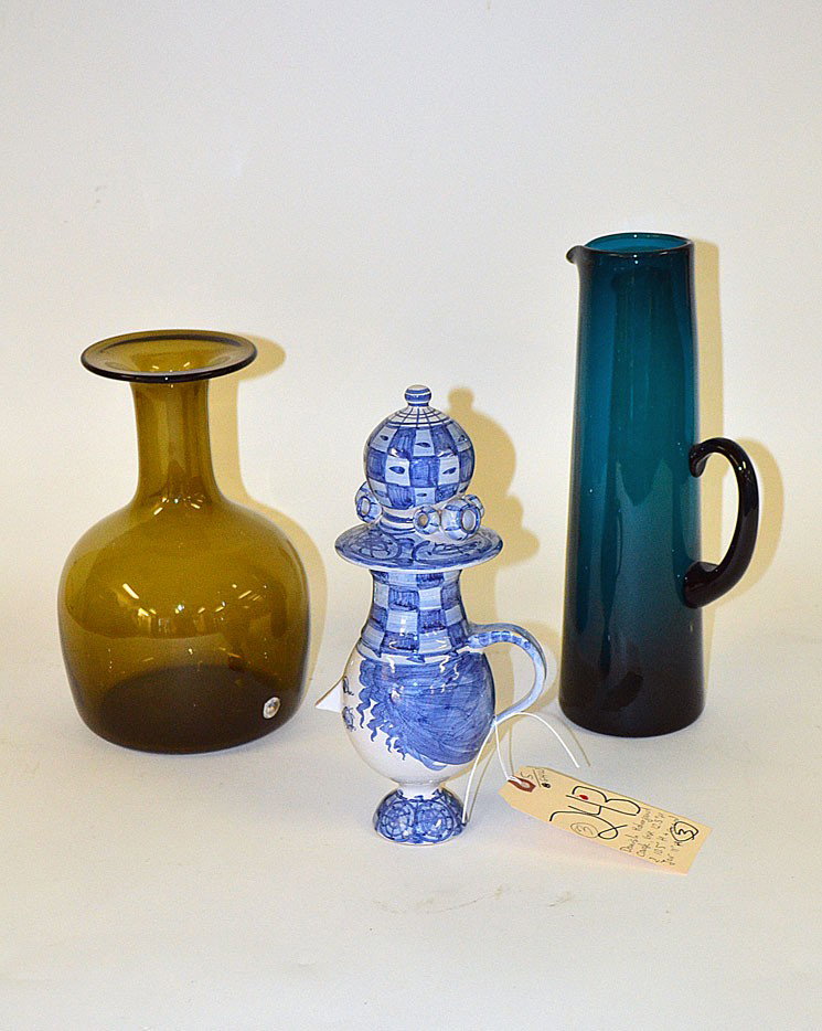 Danish Modern Glass and Ceramic Vessels: Group of modern Danish vessels comprising a blue glass pitcher vase, a green glass Holmgard carafe (10.5"), and a ceramic Bjorn Wiinblad vase with cover (11"H). All in very good condition.