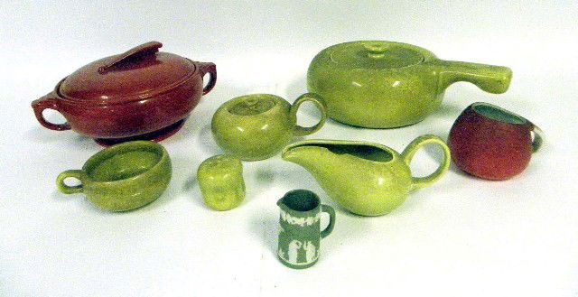 Russel Wright Group, Serving Pieces: A Russel Wright group of assorted green glazed table articles including two covered servers and a creamer, together with a Halls red covered server, a small Wedgwood creamer, and a small jug. Eight pi