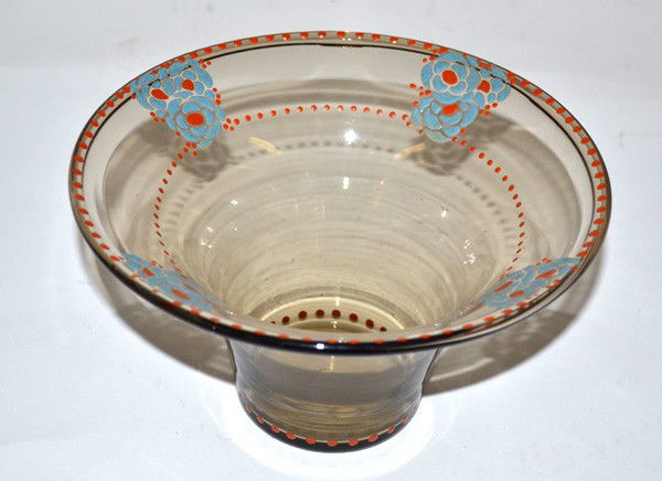 Signed Goupy Bowl: Tall smoked glass bowl, tapering toward bottom, with blue and orange enamel flower design. Signed on bottom, "M. Goupy." 7.5" Dia x 4.25" H. In very good condition.