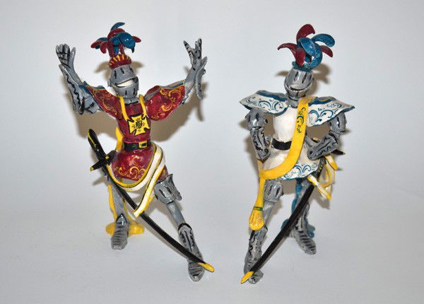 Two Martini Mid-Century Ceramic Knights in Armour: Two whimsical Italian Mid-Century glazed ceramic knights in armor. Both signed "Martini". Each figure strikes an over-the-top gestural pose. Both 8.25" H. In good condition.
