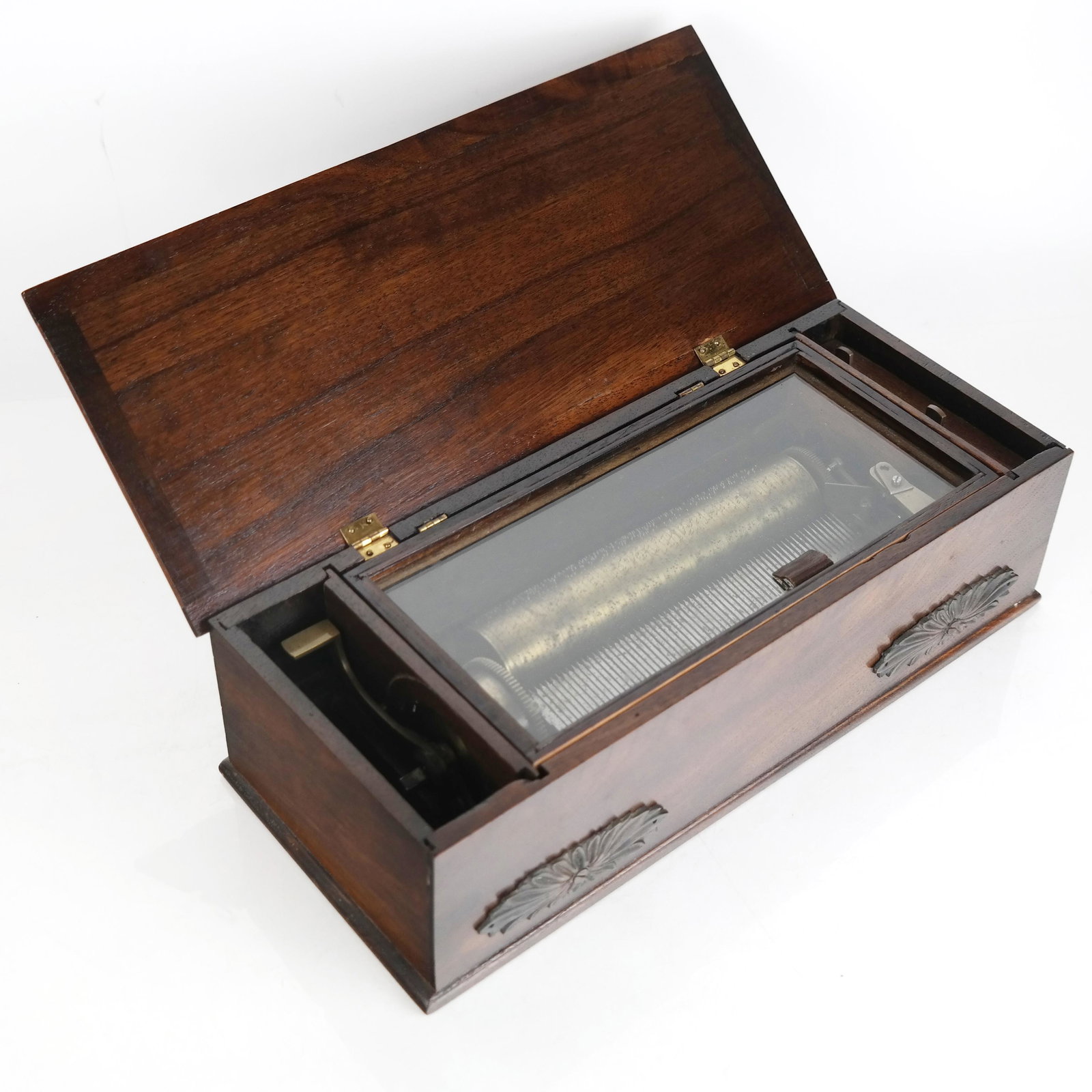 Antique Cylinder Music Box: Antique cylinder music box, probably Swiss, and plays an enchanting air. [Case: 3 7/8" H x 13 1/4" W x 5 3/4" D]. Currently working, some marks and wear to case.