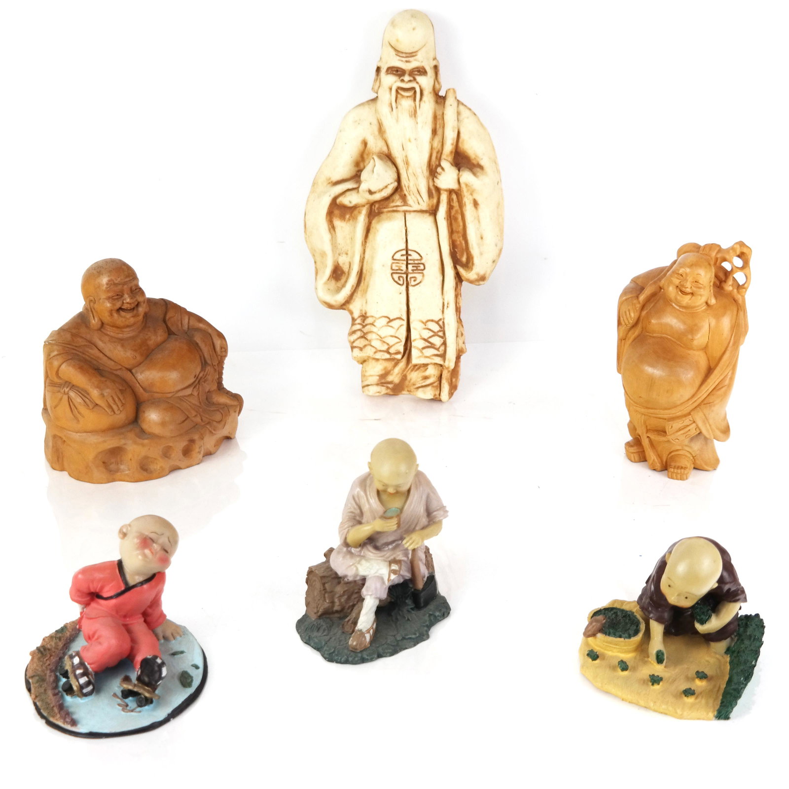 Group of Six Buddha & Monk Figures: Group of six Buddha and monk figures, including wood, stone, and resin in various poses. [Largest: 11" H x 6" W x 1" D]. Some with losses and marks.