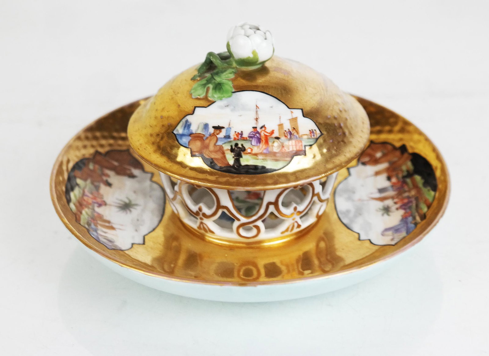 18th C. Meissen Augustus Rex Stand & Cover: 18th century Meissen Augustus Rex stand and cover, "Trembleuse", finely painted with Asian trading scenes, the galleried stand with internal floral decoration; underglaze blue AR. Fleabite to cover ri