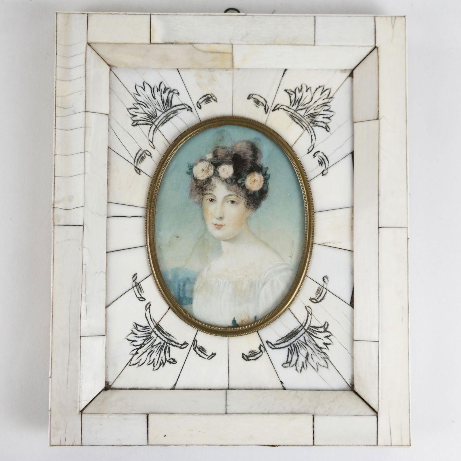 Signed E. BOTTCHER: Miniature Portrait of a Lady: Miniature painted portrait of a lady with flowers in her hair, in bone frame with gilt oval mount; signed E. Bottcher (German, 19th century). [Oval: 3 1/2" H x 2 1/2" W; Frame: 6 3/4" H x 5 1/2" W]. F