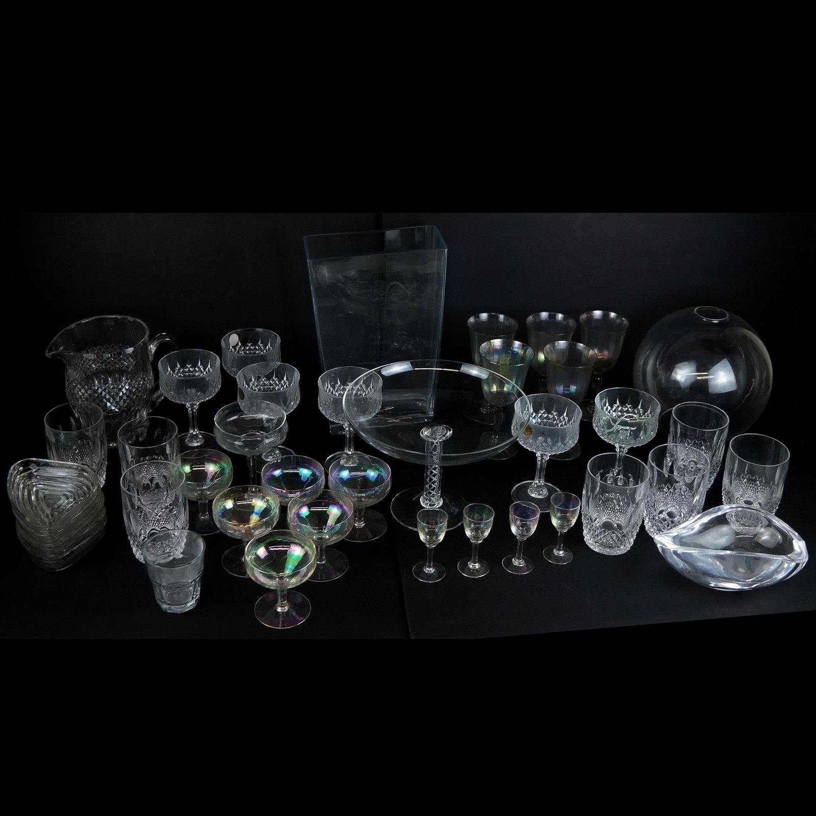 Large Assorted Group of Glassware: Large assorted group of glassware, including a pitcher, tumblers, wine glasses, and others. [Largest: 7" H].