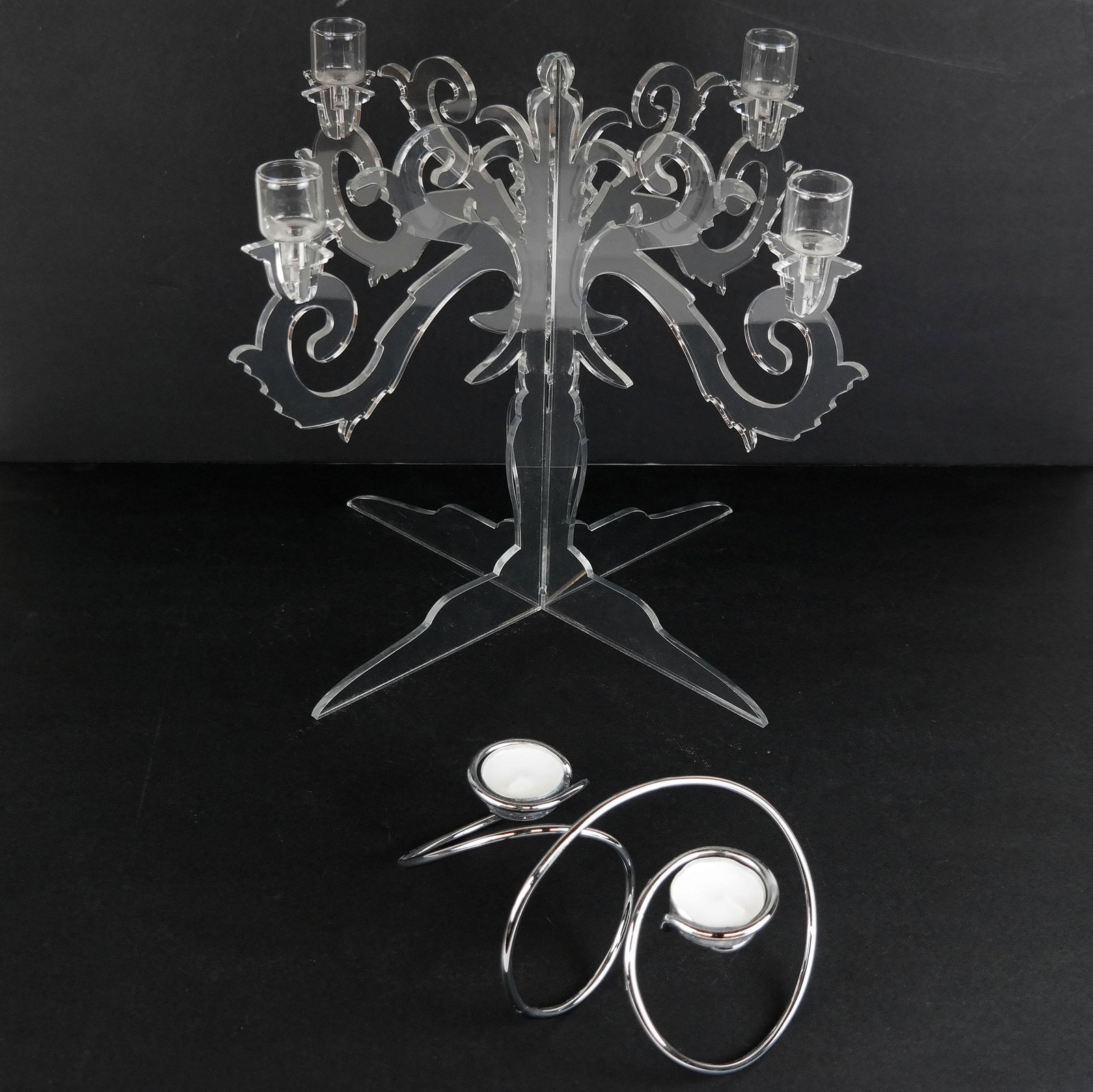 Two Acrylic & Metal Candelabra: Two acrylic and metal candelabra, including a two-light and a four-light. [Larger: 12 1/2" H x 15 1/2" Diam.]. Light abrasions and wear.