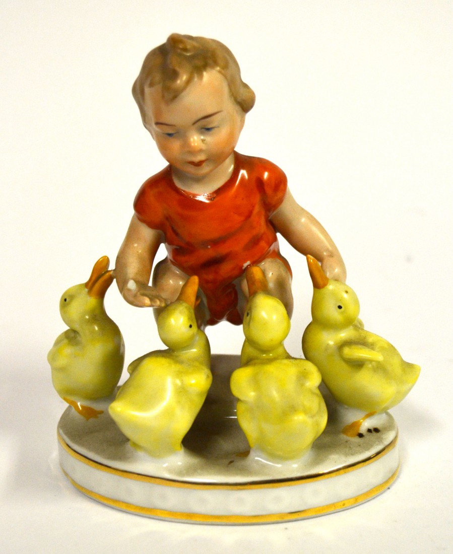 Gerold & Co. Bavarian Porcelain Figure: Gerold & Co. Bavarian porcelain figure depiction of a young boy feeding four ducklings. 5" W x 3" D x 5.5" H.