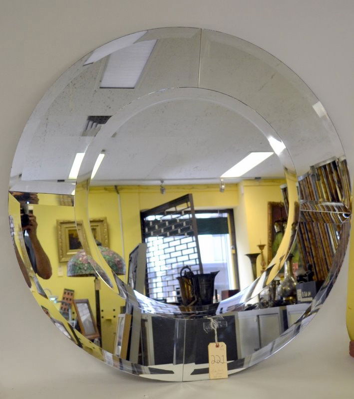 Modern Circular Mirror: Modern circular mirror contained within a wide conforming four piece mirrored surround with beveled edges. Circa 1970, in very good condition. 48" Dia.