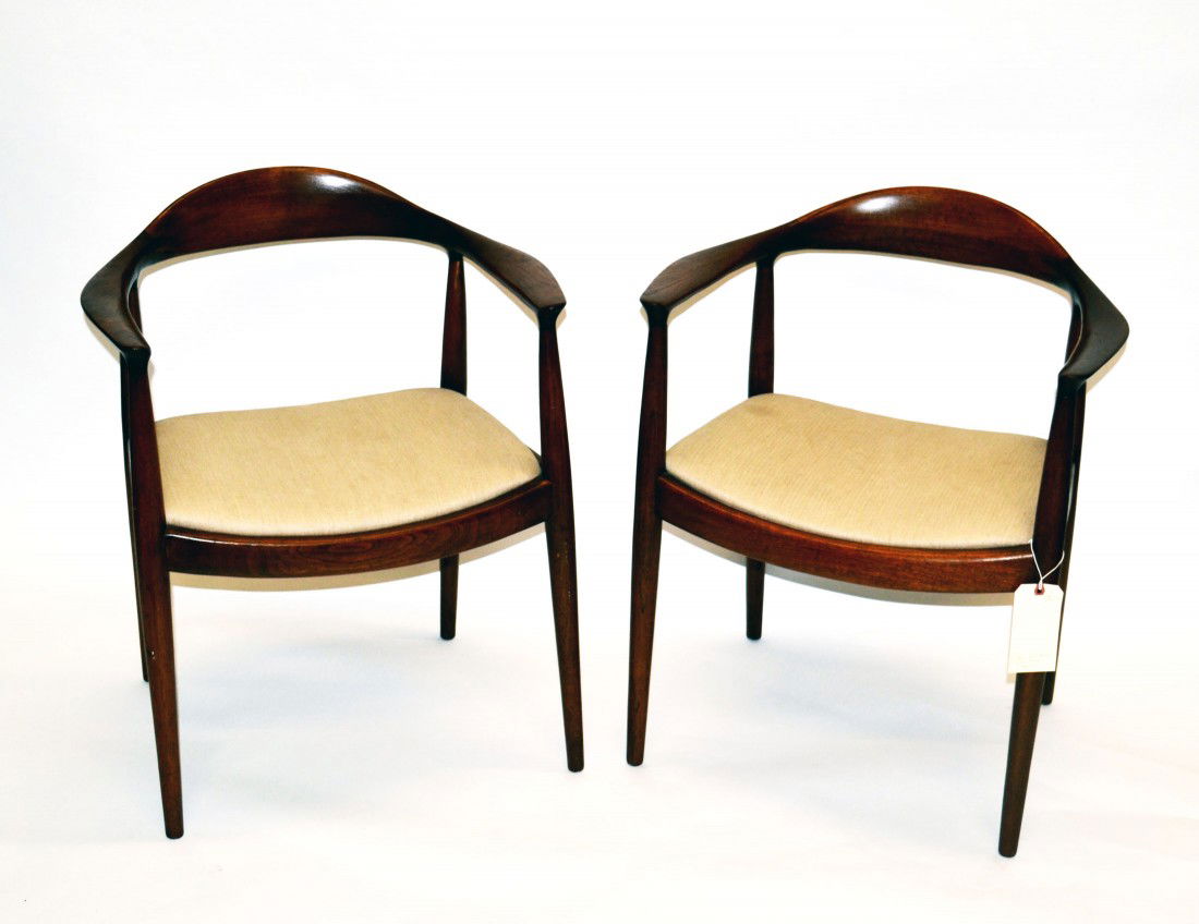 Pair of Hans Wegner "The Chair" Armchairs: Pair of Hans Wegner Danish modern "The Chair" oak open arm chairs. 24.5" W x 18.75" D x 30" H. 17.5" H to seat. Minor wear, otherwise in good condition.