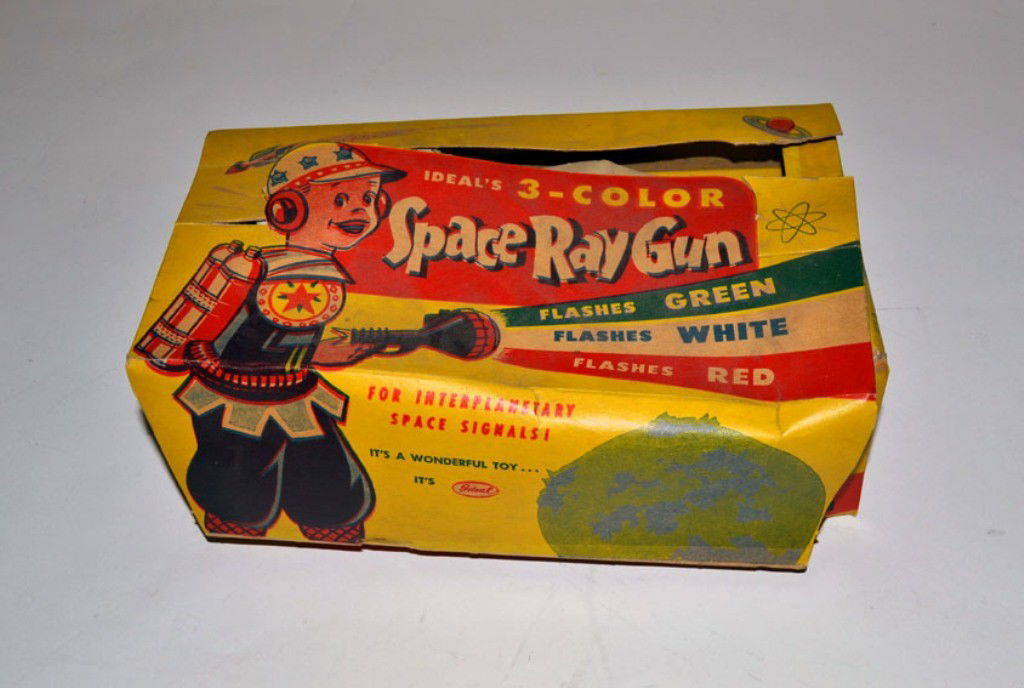 Vintage "Ideals Space Ray Gun": Vintage "Ideals Space Ray Gun…For Interplanetary Space Signals!" Ray Gun 8.75" W x 3.75" D x 5" H. In good condition. Complete with original instructions and packaging (wear and tears).