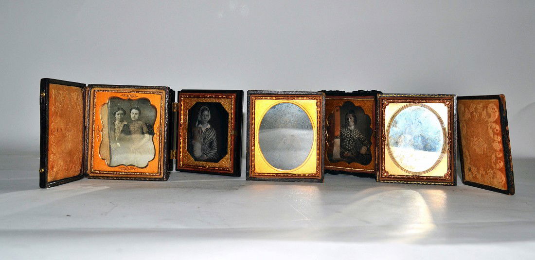 5 Daguerreotypes of Women: Group of 5 daguerreotypes (circa 1860-70). All are 1/6 plate size, in original cases, with sharp images. 3 bear minor moisture damage, and one lid detached with another missing.