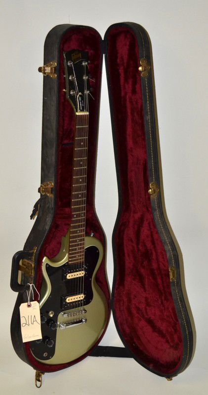 Gibson Left-Handed Sonex-180 Deluxe: Gibson left-handed Sonex-180 delux with champagne and silverbust finish, SN #80822556 (March 1982, manufactured in Nashvill, TN). 39.25" L. Light oxidation, cracks in finish on neck, minor scuffs and