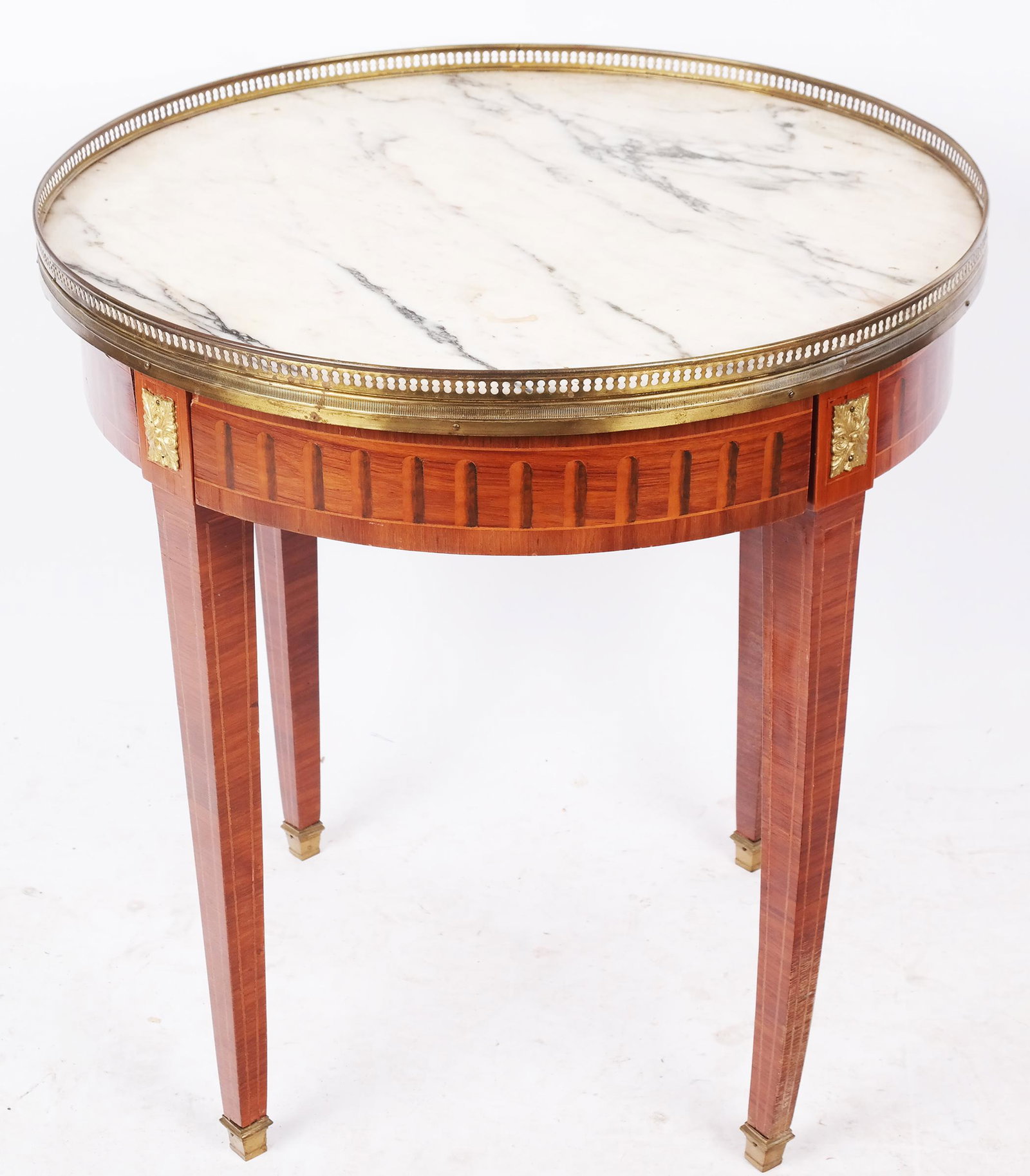 Louis XVI-Style Bouillotte Table: Louis XVI-style bouillotte table, having a round marble top with a pierced gilt metal gallery over the inlaid curved frieze, raised on tapered square legs. [26 3/4" H x 25 1/2" Diam.]. Lifting and sep