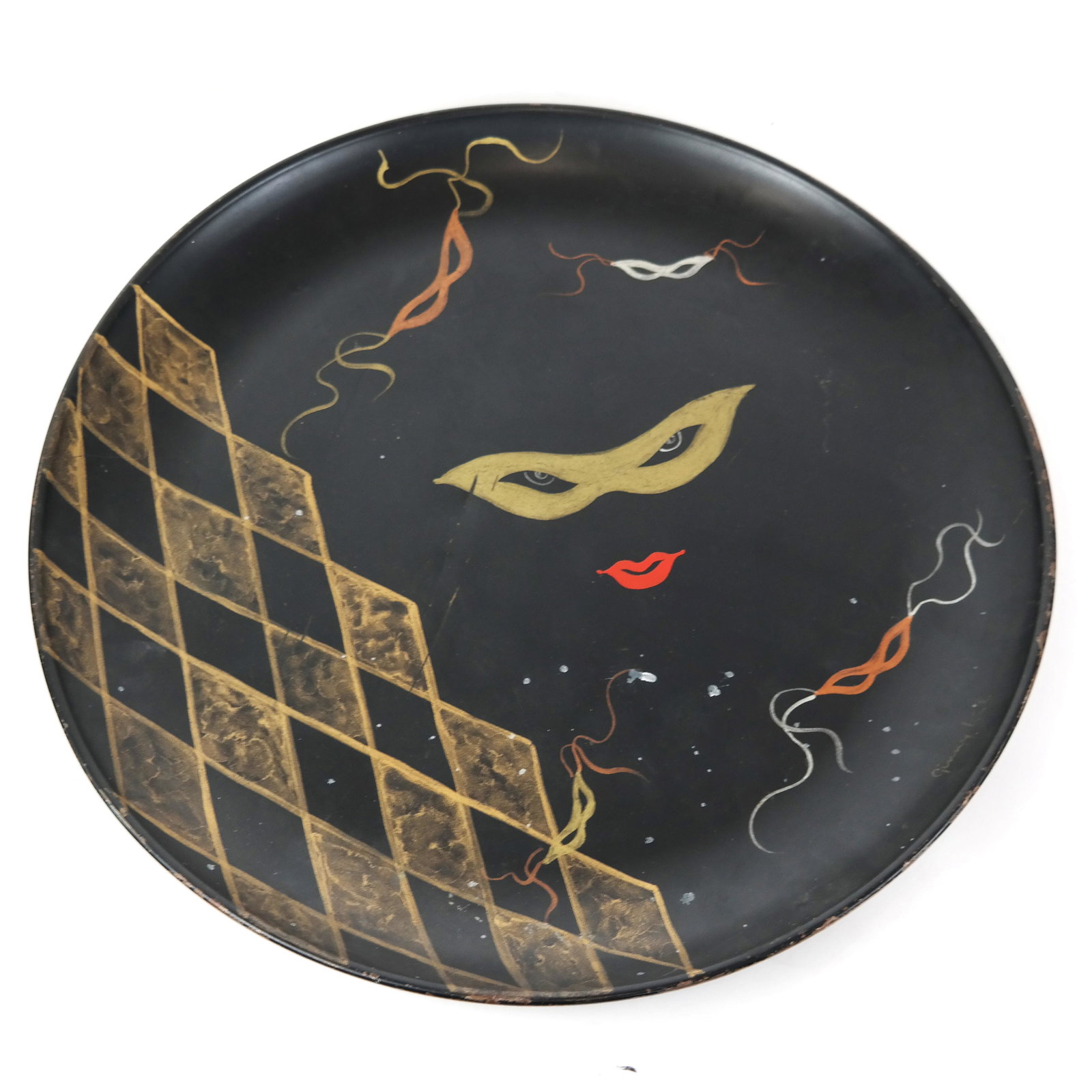 Large Tole Venetian-Style Charger: Large tole charger decorated with Venetian ball theme, signed "Ginny Lee" lower right. [20 1/4" H x 15" W]. Two scratches to central surface, chips to edges and rear.