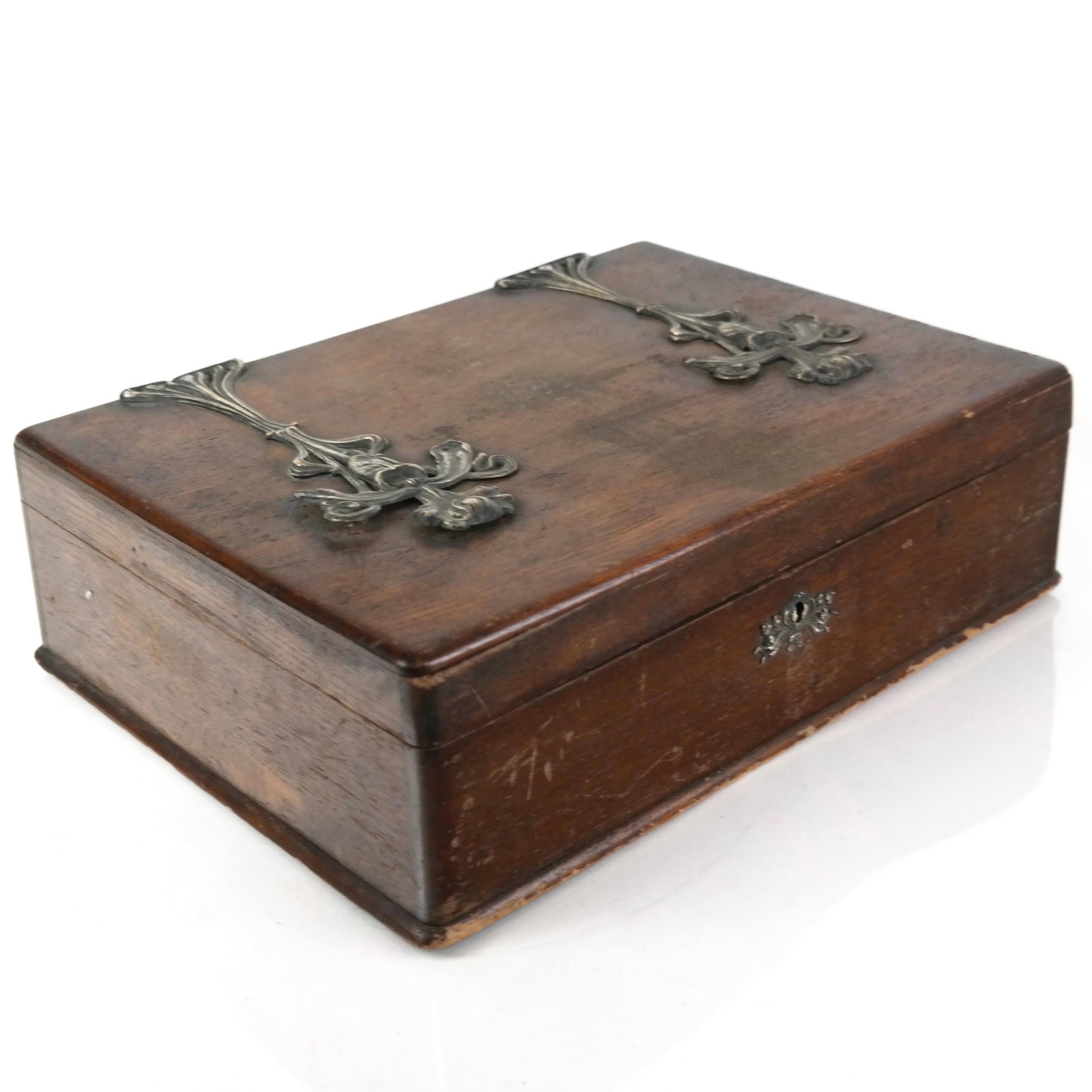 Art Nouveau Wood & Metal Box: Art nouveau wood and metal box, applied with three silvered metal floriform mounts. [11" H x 15 1/4" W x 4 1/2" D]. As is condition.