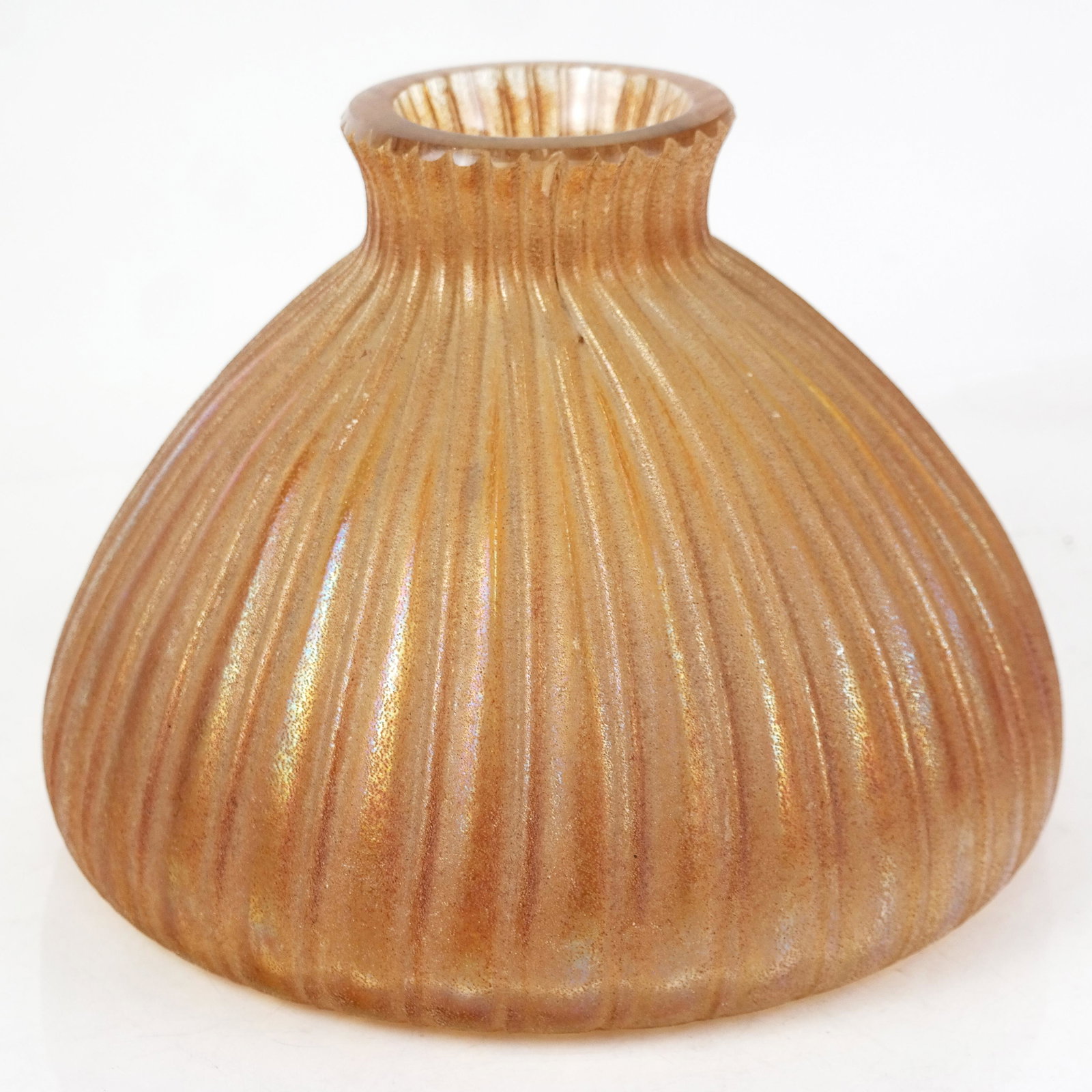Large Iridescent Glass Vase: Large iridescent ribbed vase with rough textured surface, hand blown and worked. [7 1/2" H x 11" W]. Craquelure to neck from manufacture.