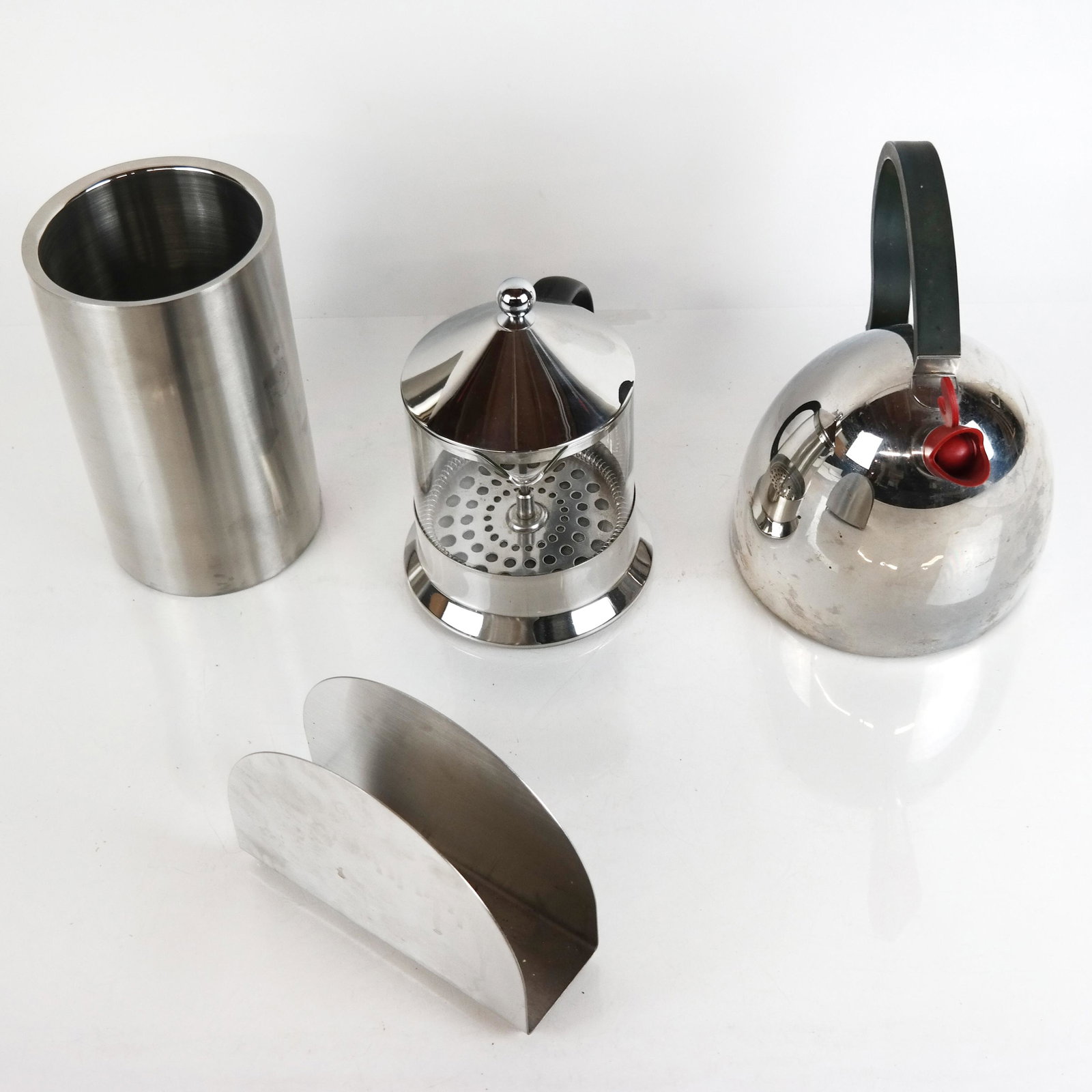 Barazzoni Progetti Design Kettle & Three Other Items: Italian Barazzoni Progetti design kettle, together with a French press, wine cooler, and napkin holder. [Largest: 8 3/4" H x 9 1/4" W]. In good condition.