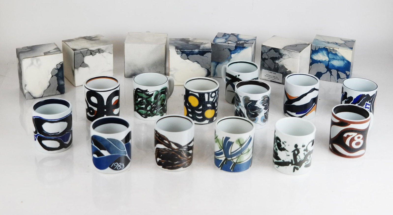 20 Royal Copenhagen Danish Collectible Mugs: 20 Royal Copenhagen Danish collectible mugs, including annual issue mugs in various years. [3" H]. Some with residue and wear.