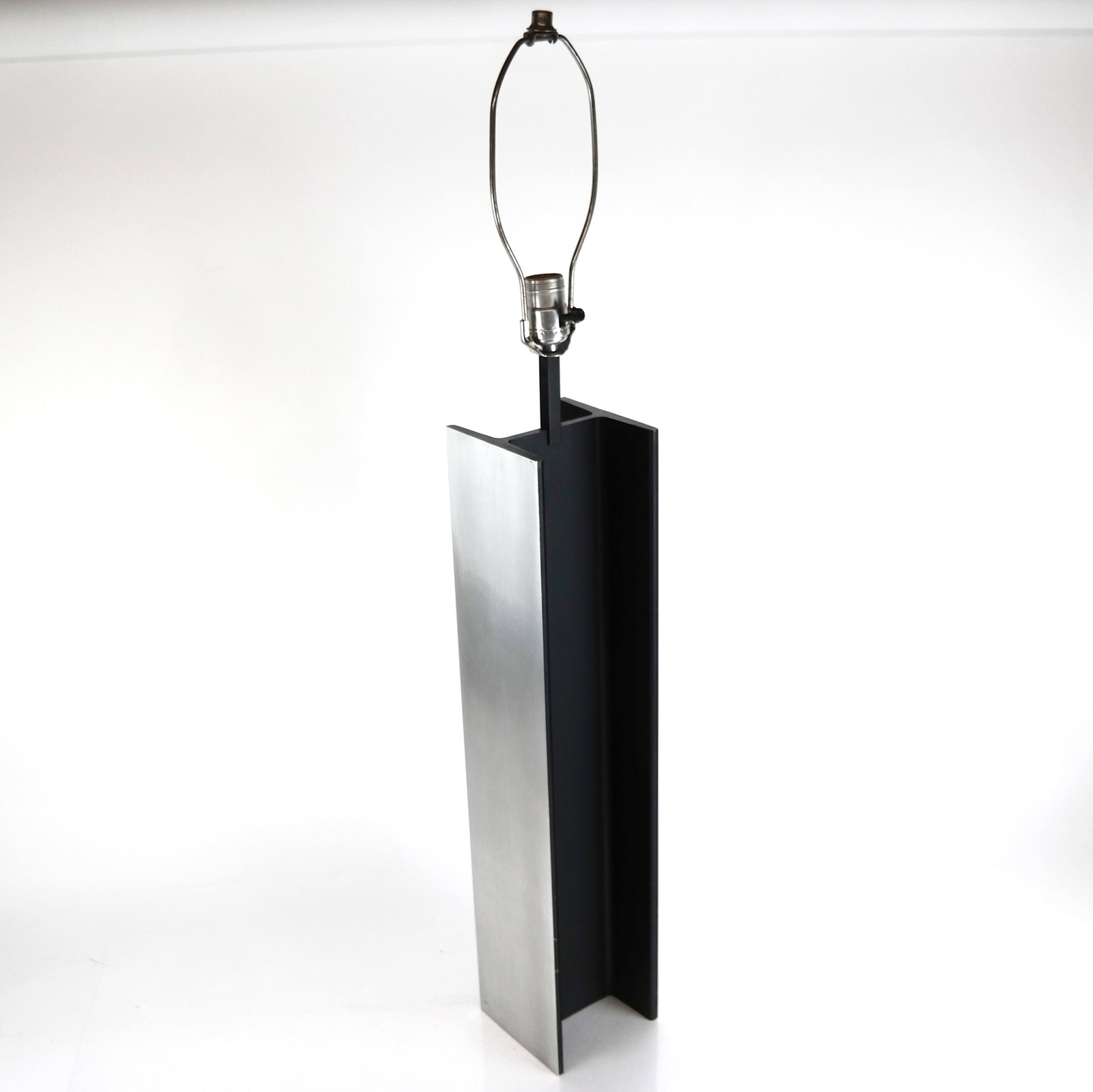 Laurel Industrial Steel Girder I-Beam Lamp: Laurel industrial steel Girder I-Beam lamp, designed in 1960s, having single light with brushed and ebonized finish. [37" H (to finial) x 5" W x 5" D]. Light abrasions and wear.