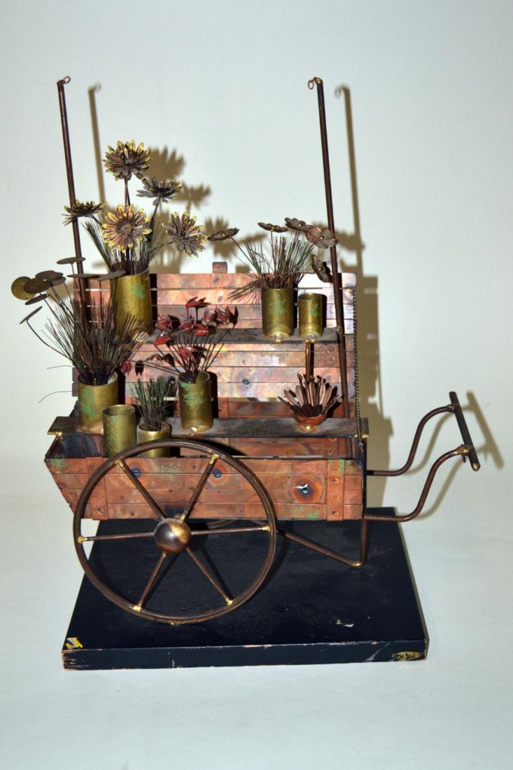 Curtis Jere Flower Cart Sculpture: Flower cart sculptural vignette comprised of brass, steel and copper. Bears a brass tag signed "C. Jere" and on bottom a Curtis Jere label by artisan house. Minor wear. 13" W x 8.5" D x 16.5"H.