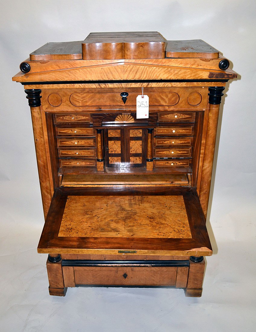 Antique Biedermeier Secretaire a Abattant: Biedermeier secretaire a abattant with clock pediment. Bears four exterior drawers. Features a fall front desk compartment with nine interior drawers, slide out writing surface and center door. 42" W 