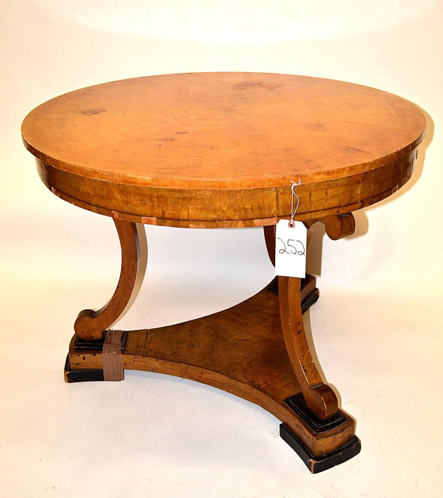 Antique Biedermeier Center Table: Biedermeier center table with starburst veneer top and tripod base. Scratches, wear, and veneer chips, otherwise complete. 39" Diameter x 31" Height.