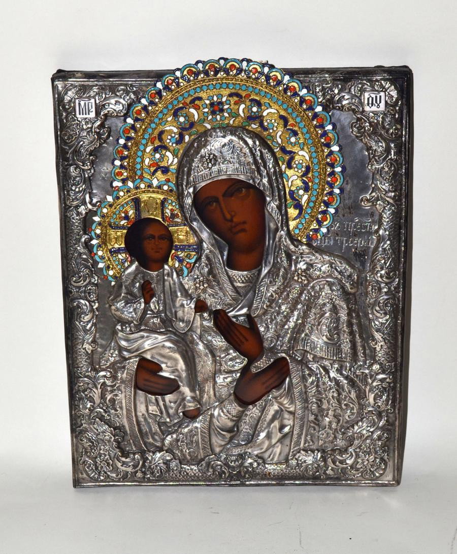Russion Icon, Madonna & Child: Russian icon depicting the Madonna and Child. Contained within a chased and engraved repousse metal cover with champleve enamel accents. 15.25" x 12.5". In good condition.