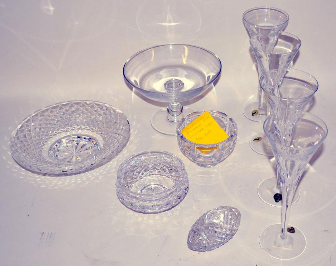 Group of Nine Fine Clear Crystal Articles: Comprises an Orrefors "Thousand Windows" bowl designed by Simon Gate, two footed Waterford bowls (5 and 9.75" diameters), a Val St. Lambert compote (8.5" Dia) 4 Waterford "London Flutes." 10" H, and a