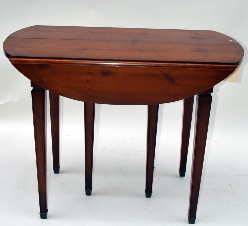 John Widdicomb Dining Table: Drop Leaf Extension, Knotty Pine Table. Tapered leges with brass sabots. Having its original crate of four leaves and label. Leaves: 13.5" Table Closd: 32"x38.25"x29.25"h
