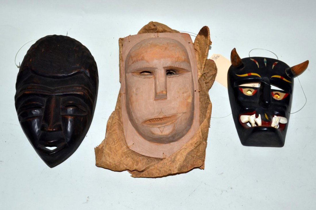 Three International Ethnic Masks: Group of three international ethnic carved wood masks.