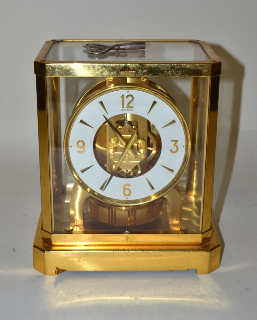 Jaeger-LeCoultre Atmos Mantle Clock: In a brass case with all around glass panels showing clock works. 8.5"x6.5"x9.25"