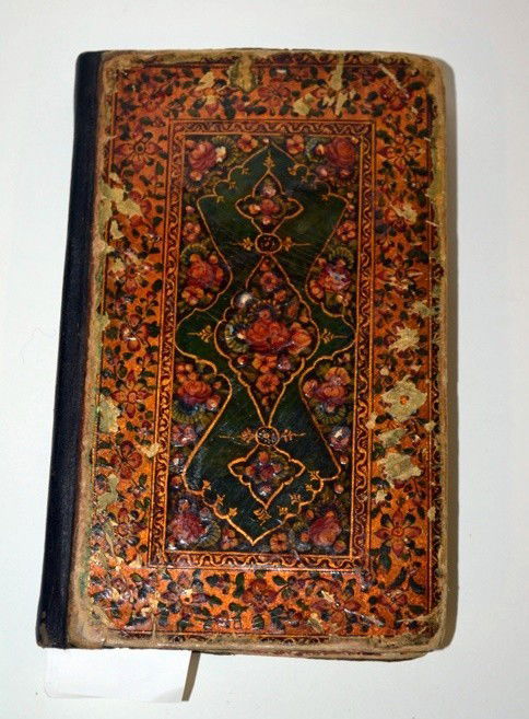 Antique Middle Eastern Book of Poetry: Antique middle eastern manuscript book of poetry with printed and hand-colored illustrations. 7" x 4" x 3/4". Uneven age toning and staining throughout. Re-bound and spine replaced. Board covers chipp