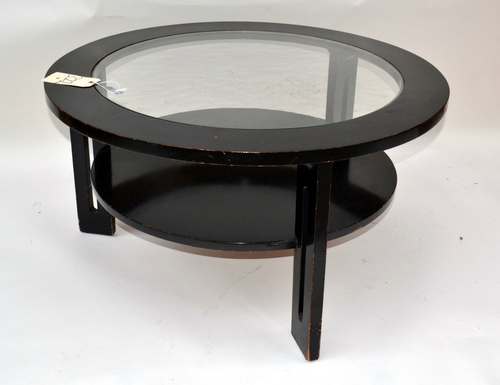 Circular Black Lacquered Coffee Table: Circular two-tier black lacquered coffee table having glass top. 36" round, 19" tall.