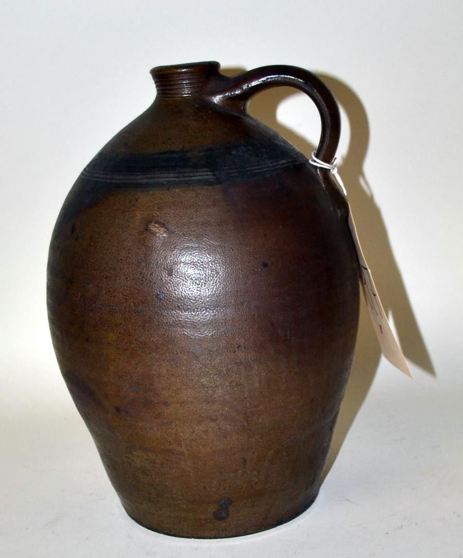 American Earthenware Jug: Features incised bands at top and spout. In very good condition. 11.25"H x 8"diam.