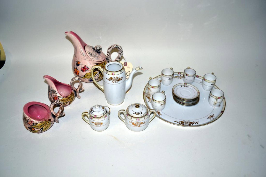 Nippon Tea Service for Six: 6 cups, 6 saucers, sugar bowl, creamer, pot, and circular serving tray. Accompanied by three-piece tea service by Hull circa 1935, sugar, creamer, and pot. Tallest 8.25" 19 pieces.