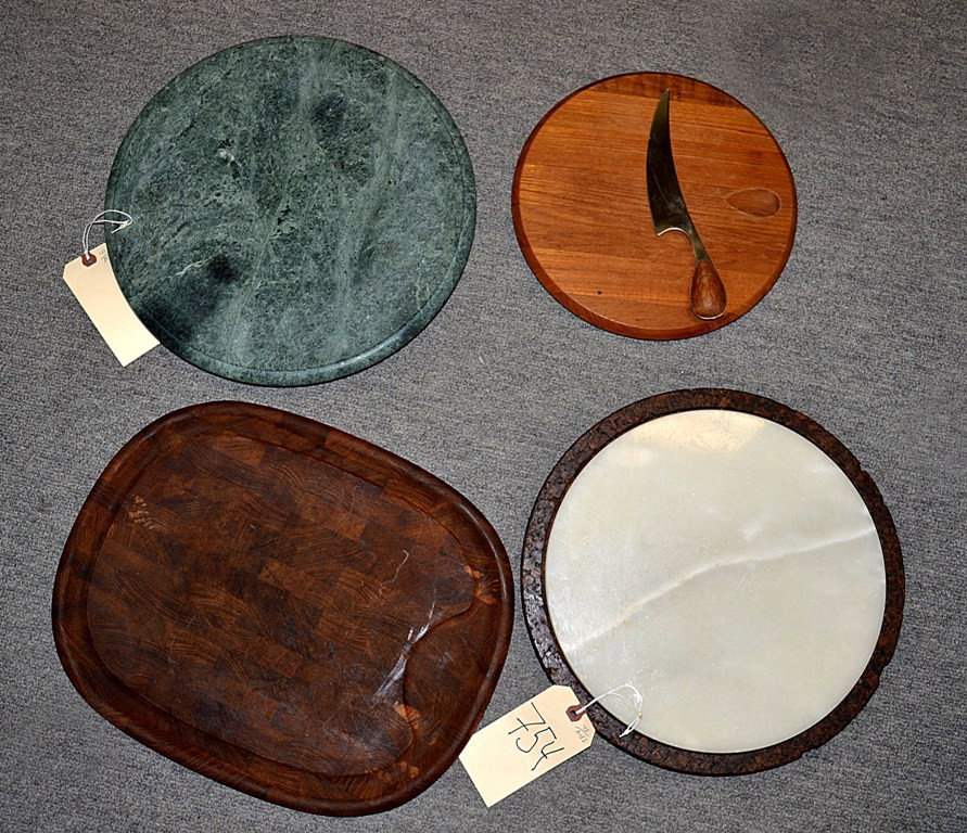 Four Cutting Boards: Comprises: a circular wood Dansk board with integral knife (11" dia), an ovoid walnut butcher block style Dansk board (13" x 16.25"), a circular white alabaster board (12" dia), and a green marble rot