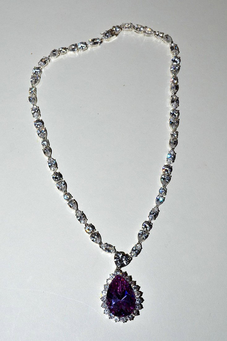 Sterling Silver Necklace: With purple stone teardrop pendant and clear paste gems.