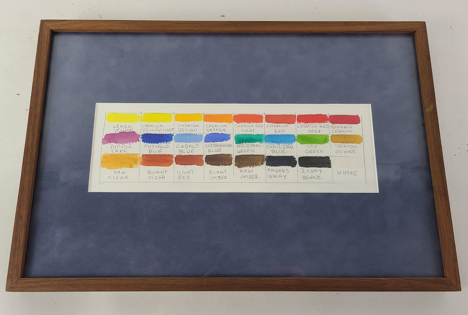Color Chart - Pencil and Gouache on Canvas: Color chart, in pencil and gouache on canvas, framed in plexiglass. Provenance: Phyllis Lucas Gallery, NYC. [Art: 2.5" H x 10" W; Frame: 10.5" H x 16" W]. In good condition.