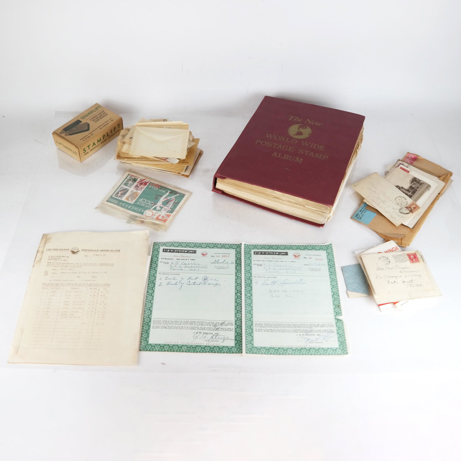 Small Philatelic Collection: Small philatelic collection, including books, receipts, and loose stamps. Provenance: From the Museum Gallery Bookshop in Fairfield, Connecticut.