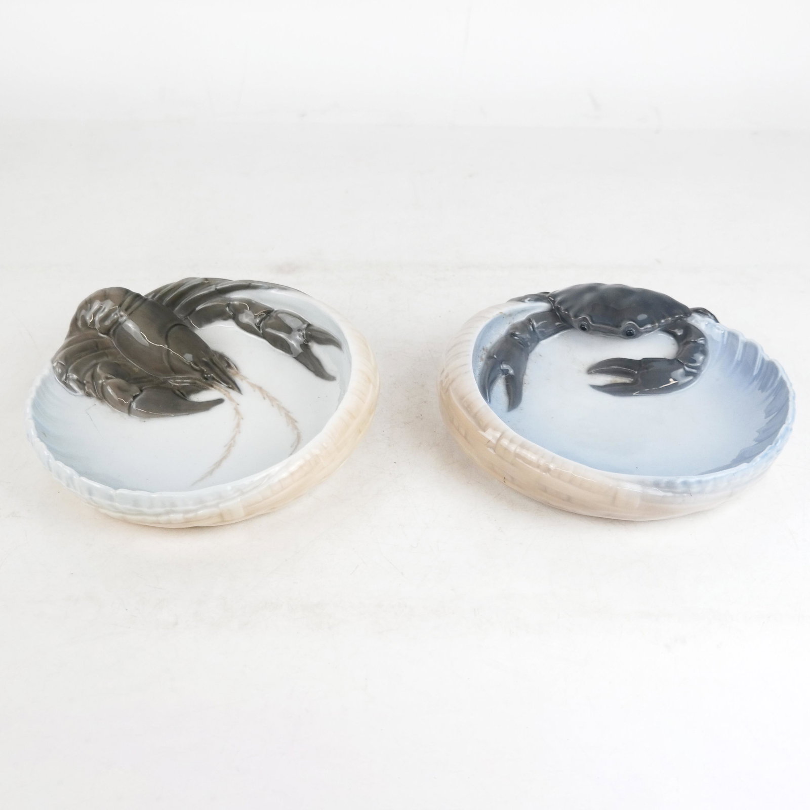 Royal Copenhagen Danish Porcelain Dishes: Royal Copenhagen Danish porcelain dishes of nautical/maritime interest, each dish/ashtray with crab or lobster motif; marked to bases. [2" H x 6 1/2" Diam.]. A few marks and wear.