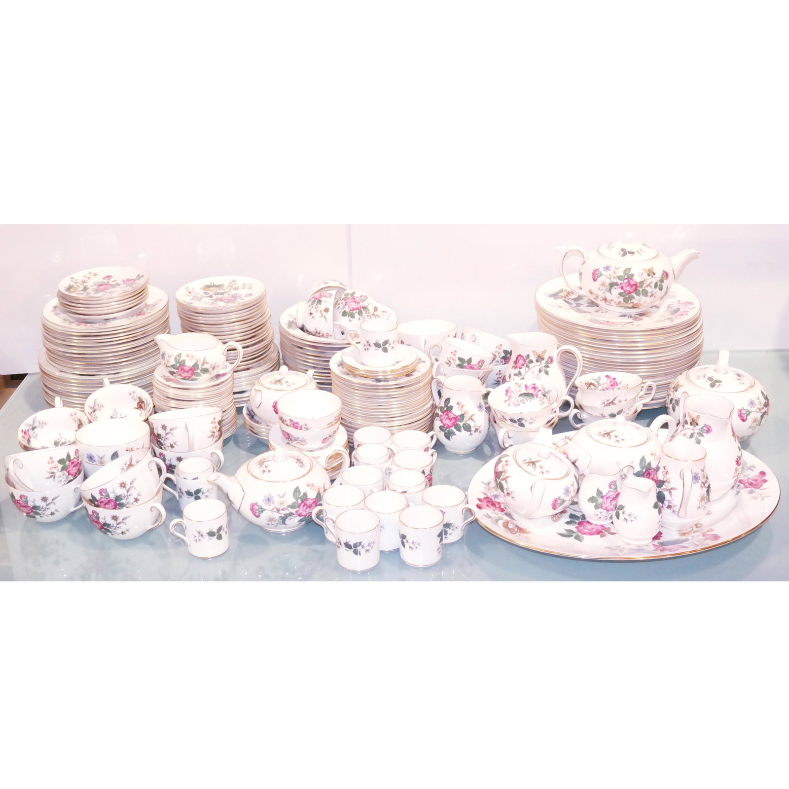 Wedgwood Bone China English Hospitality Service: Wedgwood bone China English hospitality service, an extensive 175 piece service in the "Charnwood" pattern, with flower and butterfly decoration and gold borders; all marked with company logo and deta