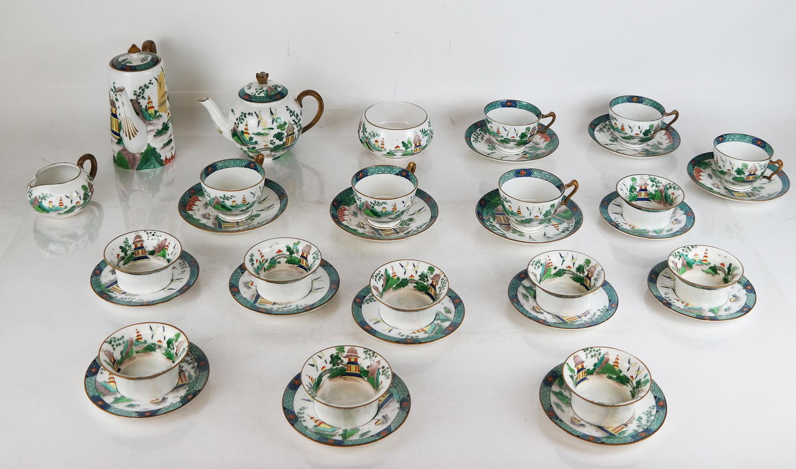 Crown Staffordshire England Tea/Coffee Service: Crown Staffordshire England tea/coffee service of unusual forms and style in bold colors, consisting of nine bowls on saucers, six teacups and saucers, a teapot, a coffee pot, a sugar basin, and a mil
