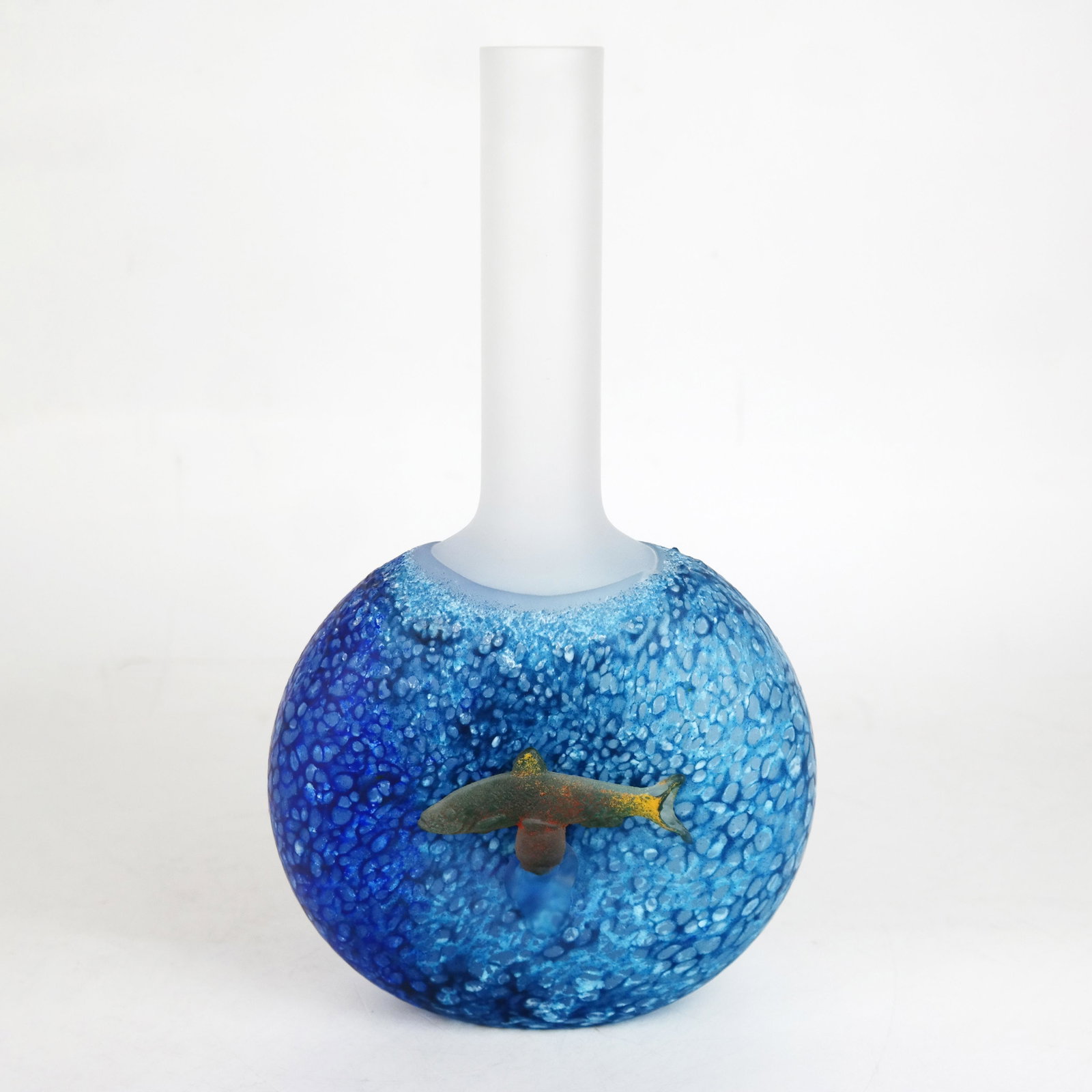 Kjell ENGMAN: "Reef" Glass Vase (2002-2007): Kjell Engman (Swedish, b. 1945) clear glass vessel applied with blue glass and modeled fish with hot powder color, titled "Reef," 2002-2007. [10 1/2" H x 6" W x 2 1/4" D]. Fish tail with internal flaw