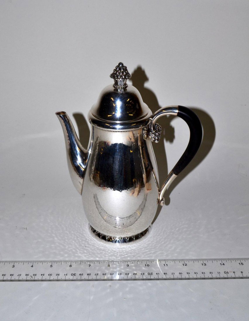 Georg Jensen Sterling Coffee Pot: Having berry cluster finial and ebony handle. 10" H. 28 troy oz.