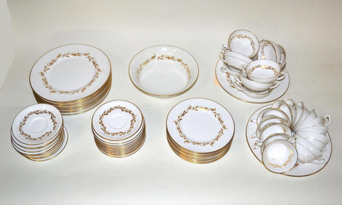 Royal Worcester Dinner Service, 88 Pieces: English porcelain dinner service, white and gold decorated, by Royal Worcester, England. Including twelve dinner plates, twelve salad plates, thirty six cake plates, twelve soup and twelve tea cups an