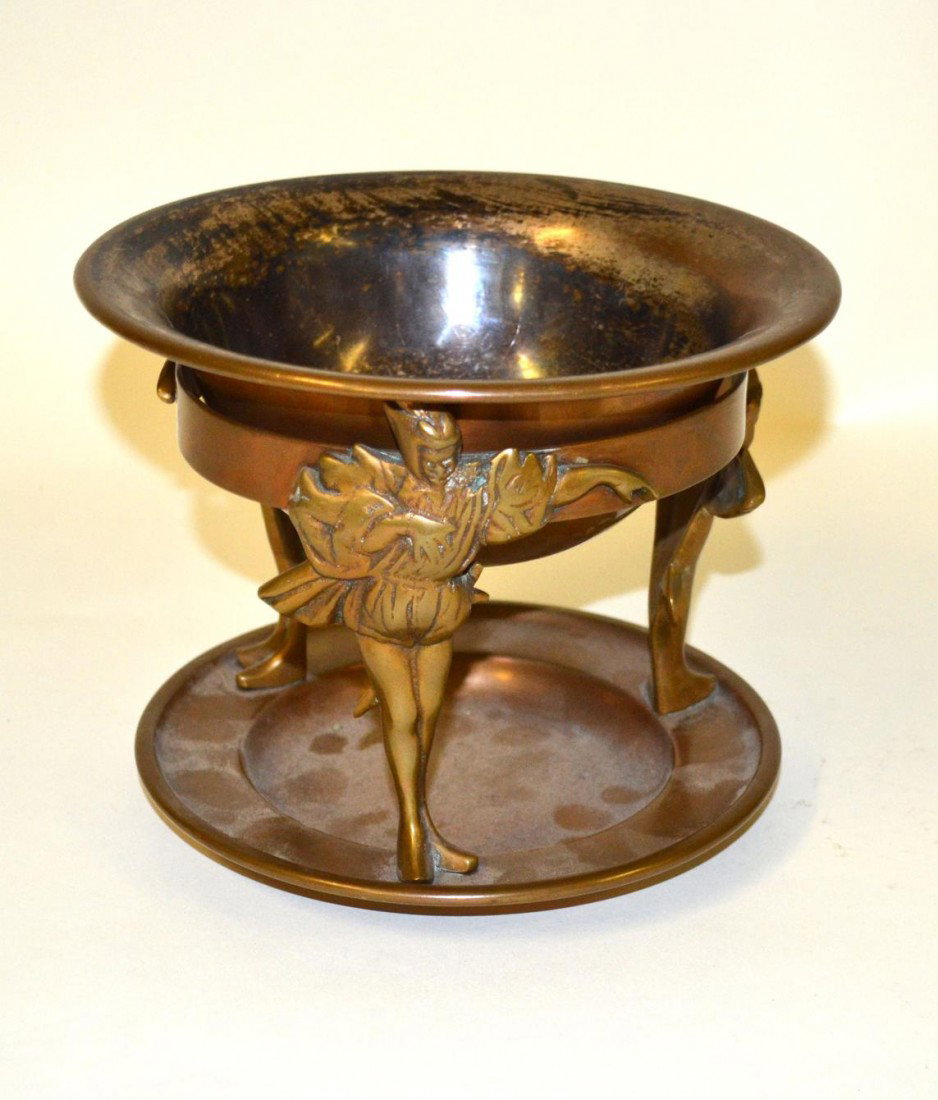 Jos. Heinrichs Paris & NY Tazza: Sterling silver-over-bronze two part tazza bowl, supported by three jester figural base supports. By Jos Heinrichs - Paris & N.Y. Wear. 8" dia x 6.5" H.