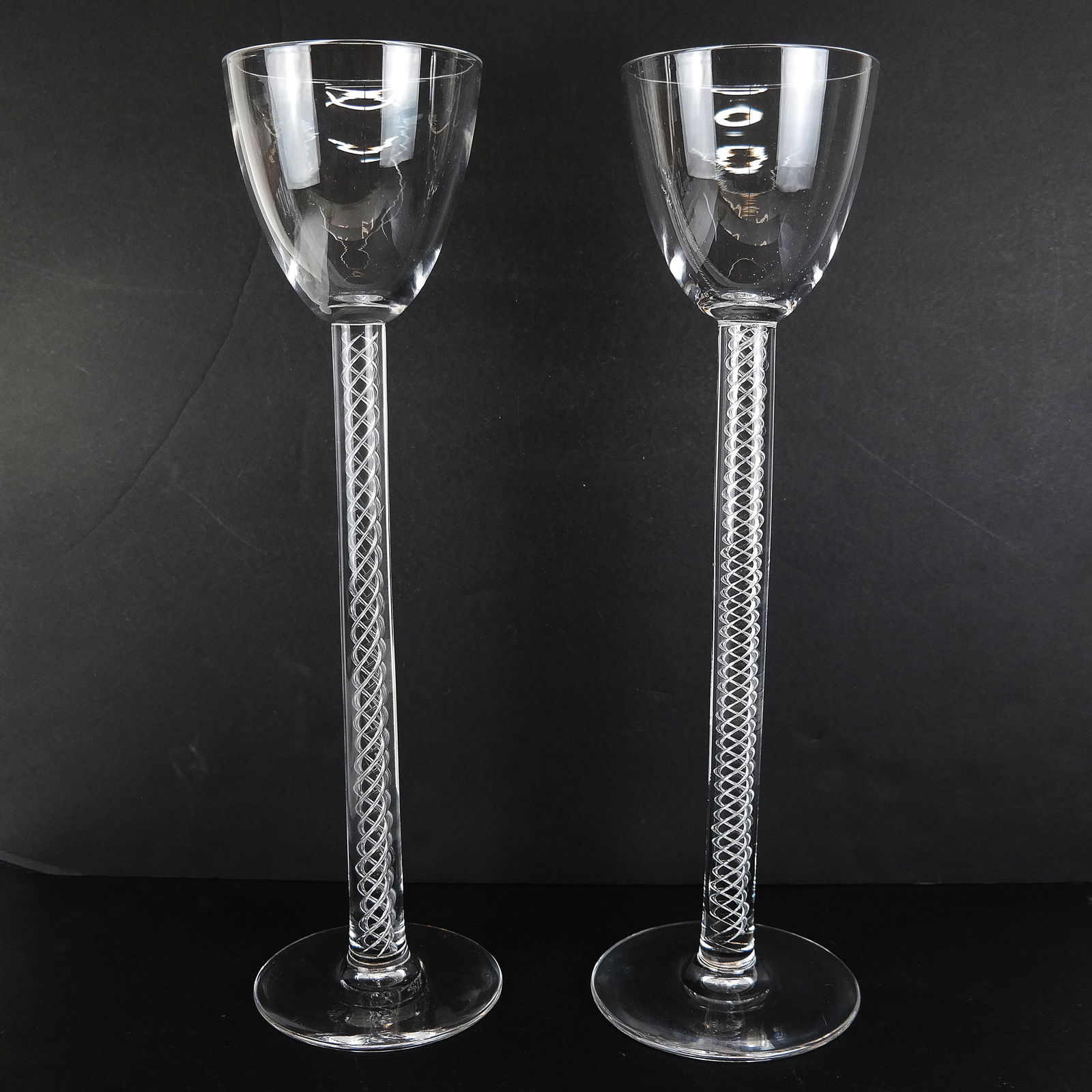 Pair of Tall Steuben Goblet Stems: Pair of Steuben wine stems/goblets on long interior twist posts. [18" H x 5" Diam.].