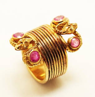 Ilias Lalaounis 18K Gold & Ruby Snake Ring: 18K yellow gold and ruby snake ring marked "750", with 4 ruby cabochons, size 4. 11.6 grams, 7.5 dwt. In good condition.