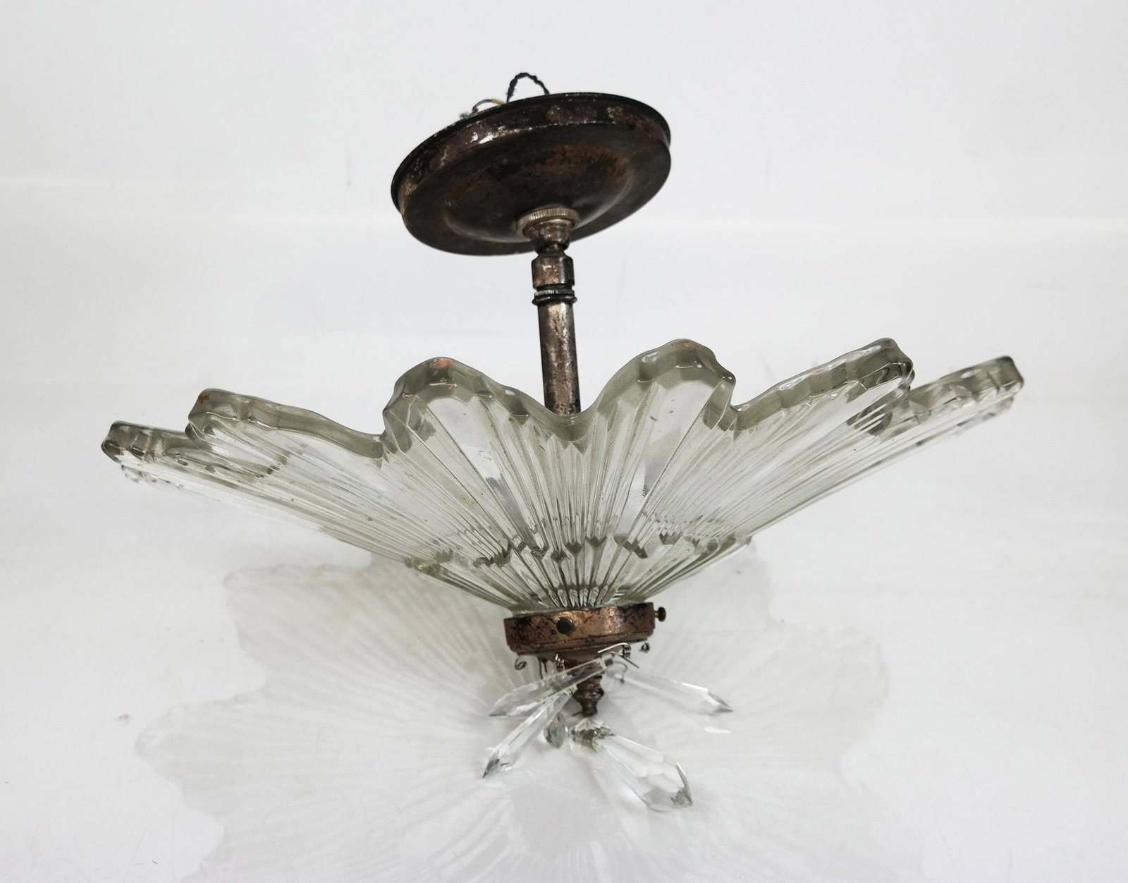Art Deco-Style Glass Chandelier: Art Deco-style glass chandleier of suburst outline and details with pendant prisms. [10 1/2" H x 15 1/2" Diam.]. Scuffs and losses to glass; oxidation to metal.